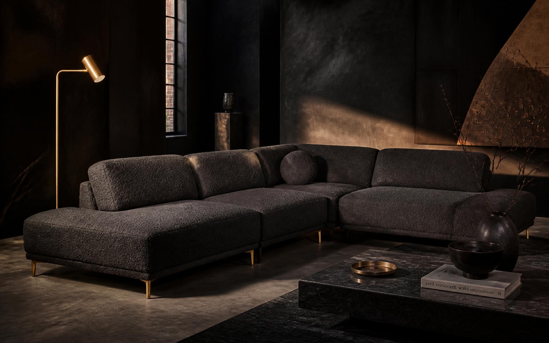 Charcoal bouclé modular sofa in a dark loft living room